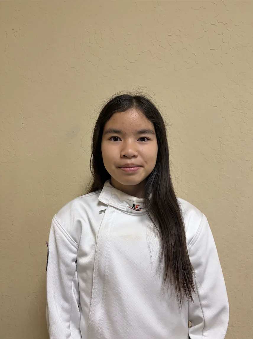 Portrait of Audrey Truong in fencing gear